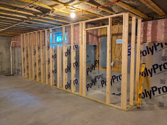 2x4 walls and foam insulation against basement walls