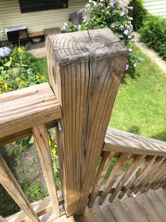 treated lumber deck post with shrinkage cracks