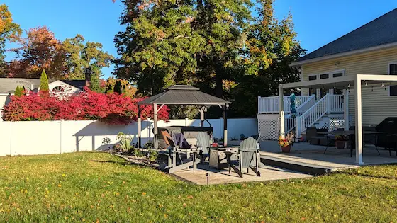 outdoor patio with hot tub fire pit and kitchen