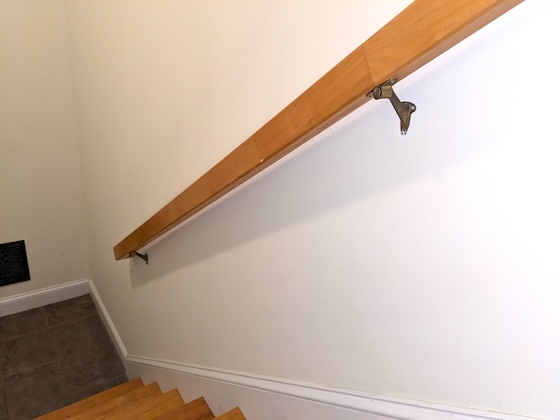 maple handrail on drywall