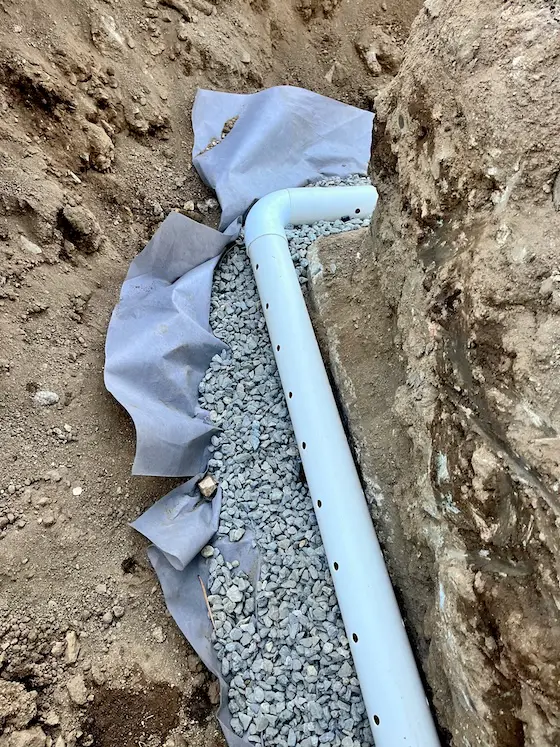 foundation drain tile perforated pipe and useless filter fabric